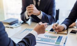 iStock-1022888604-finance-graph-meeting